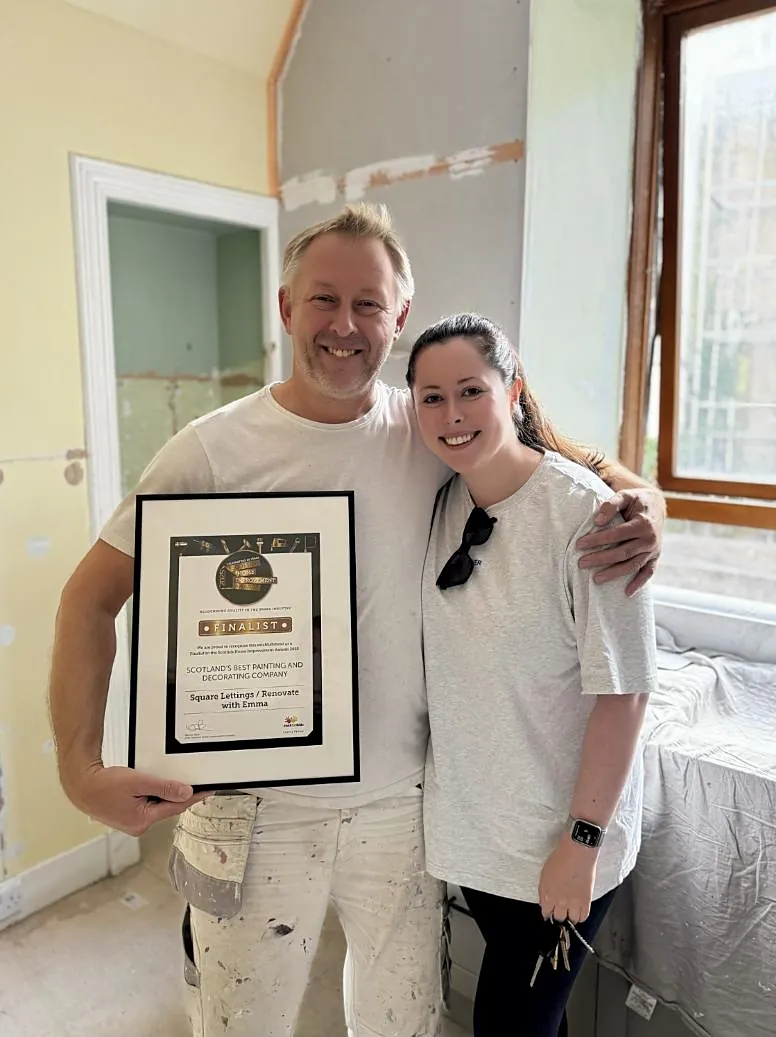 Emma and Robert, the Square Lettings decorator, holding a finalist certificate